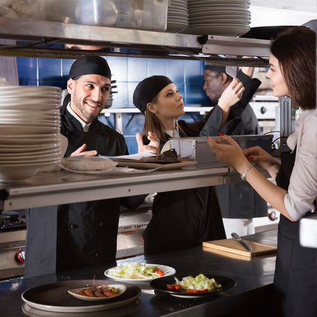 Waitress and cook communicating