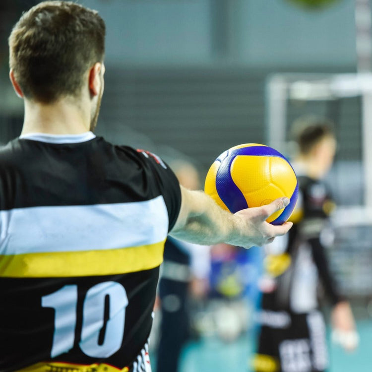 Volleyball player about to serve