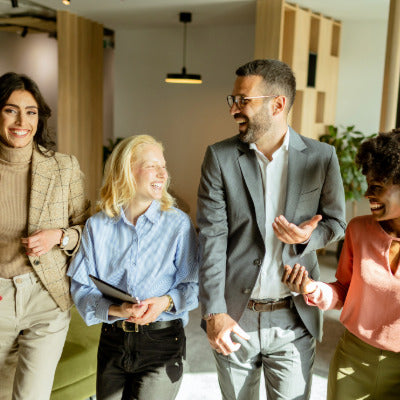 Image showing four adults talking and smiling