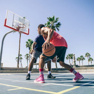 Image showing two men on a basketball court playing basketball