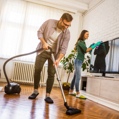 Image showing a man and woman cleaning a house