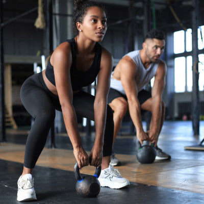 Image showing two people lifting weights