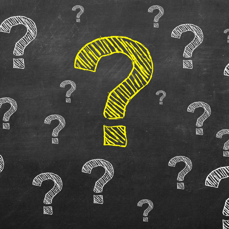 Question marks on blackboard